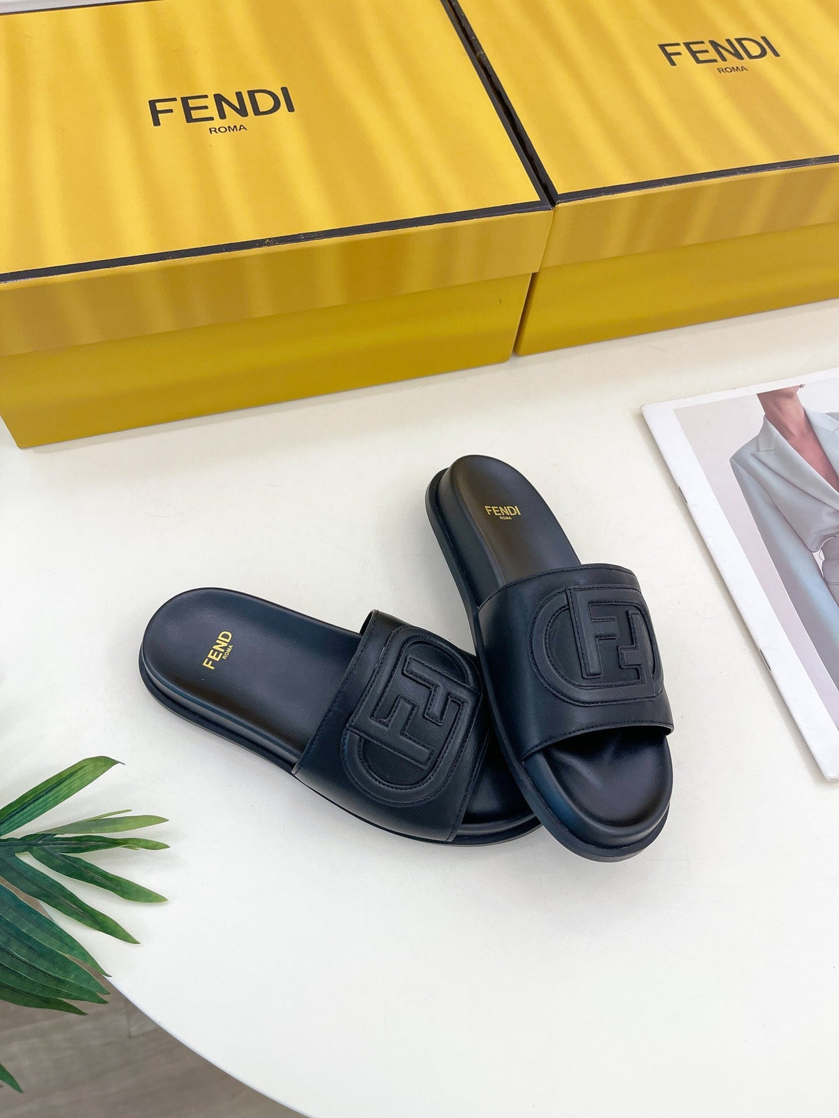 FENDI LOGO SLIDES IN BLACK CALFSKIN