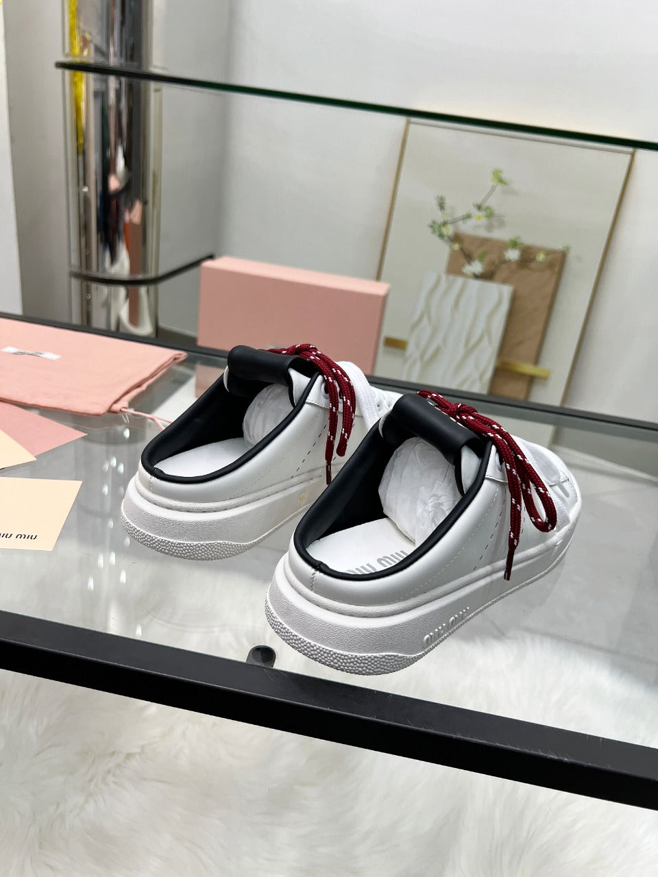 SNEAKER MULES IN BLACK AND WHITE CALFSKIN WHITE RED LACES